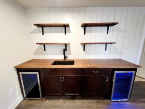 custom wood bar with floating wood shelves