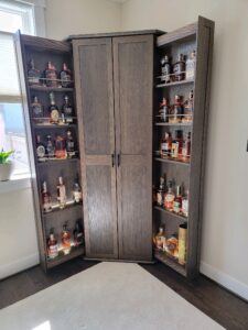 custom made dark wood corner liquor cabinet
