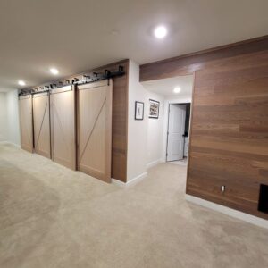 basement with custom farmhouse style sliding doors
